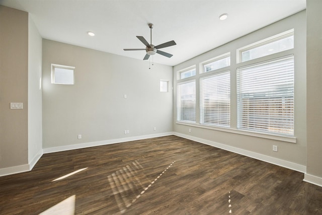 unfurnished room with a ceiling fan, baseboards, dark wood-type flooring, and recessed lighting