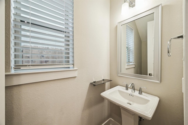 bathroom with plenty of natural light and a sink