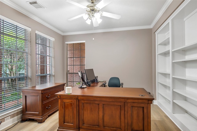 office space with ceiling fan, light wood finished floors, visible vents, and crown molding