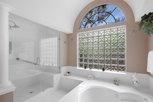 full bath with a stall shower, decorative columns, lofted ceiling, and a bath