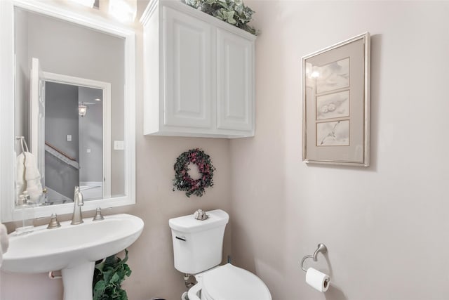 bathroom with a sink and toilet