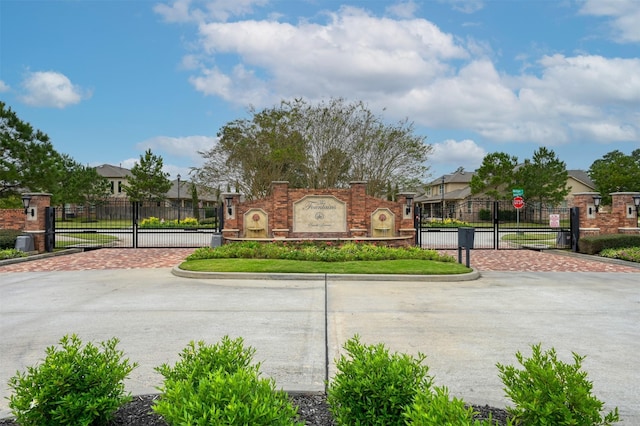 15331 Westland Gate Dr, Conroe, TX 77384 - community / neighborhood sign featuring fence, a residential view, and a gate