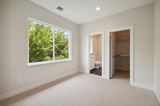 unfurnished bedroom featuring recessed lighting, carpet flooring, visible vents, and baseboards