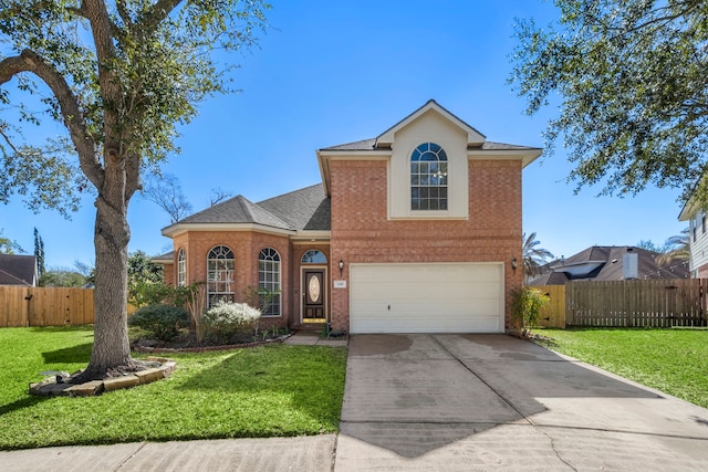 traditional-style home with an attached garage, brick siding, fence, concrete driveway, and a front yard