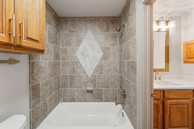 bathroom with toilet, tub / shower combination, and vanity