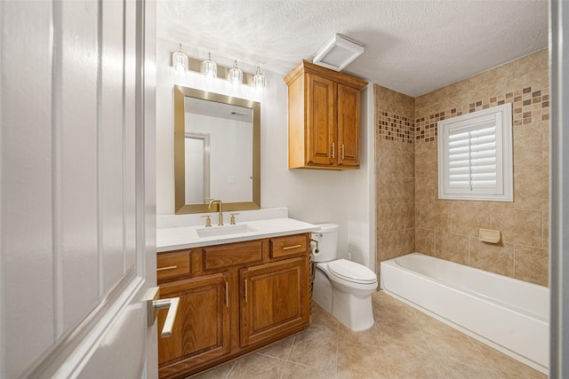 bathroom with tile patterned flooring, a textured ceiling, toilet, and vanity