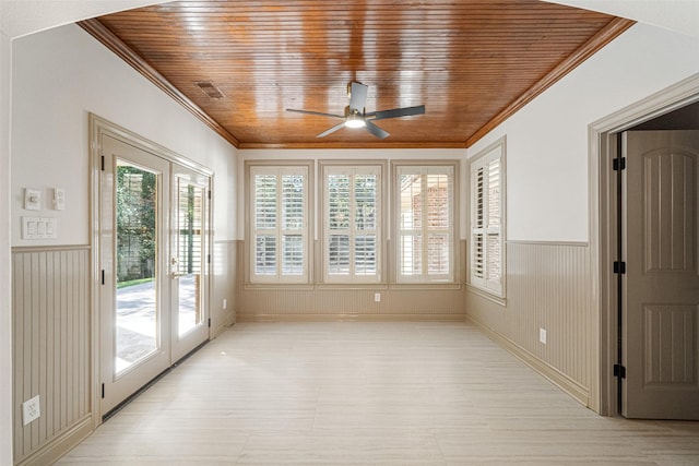 unfurnished sunroom featuring visible vents, ceiling fan, french doors, and wood ceiling