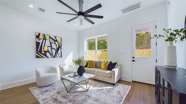 living area featuring wood finished floors, visible vents, and recessed lighting