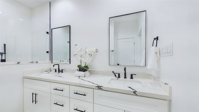 bathroom with a sink and double vanity