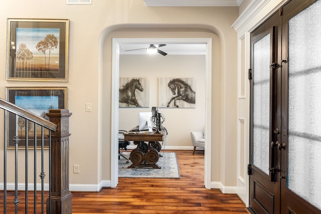 entryway featuring french doors, stairway, wood finished floors, and baseboards