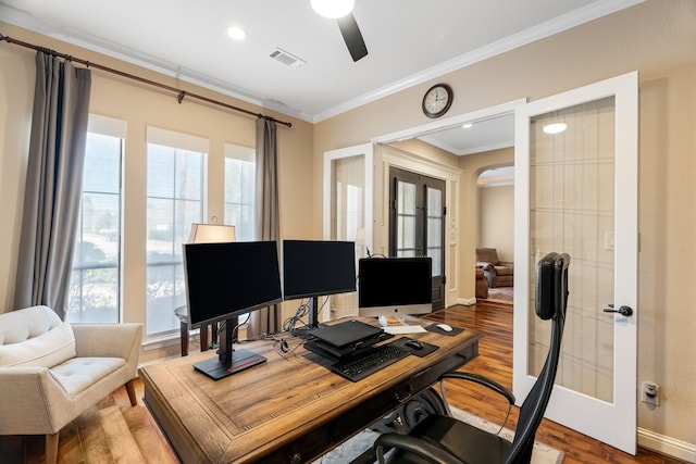 home office featuring french doors, visible vents, ornamental molding, ceiling fan, and wood finished floors