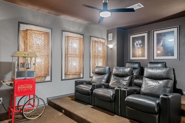 home theater with carpet, visible vents, and ceiling fan