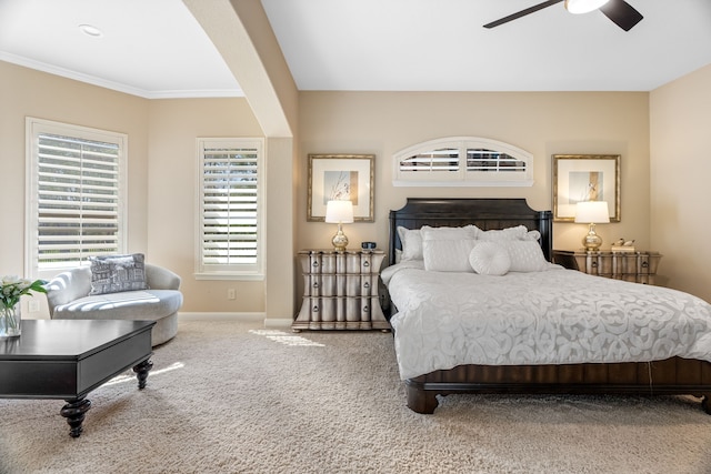 bedroom featuring ornamental molding, carpet, ceiling fan, and baseboards