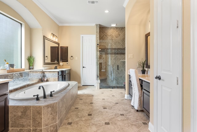 full bath featuring ornamental molding, a stall shower, a garden tub, and vanity