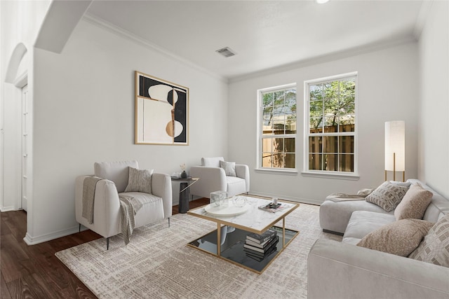 living room with baseboards, visible vents, dark wood-style flooring, and crown molding