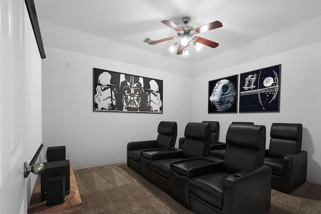 cinema with carpet floors, baseboards, visible vents, and a ceiling fan