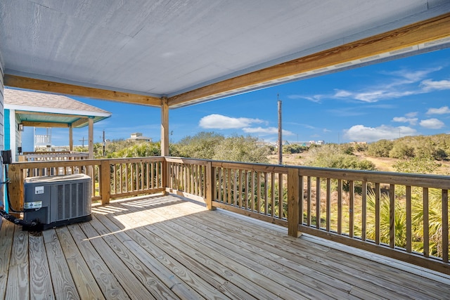 wooden terrace featuring cooling unit