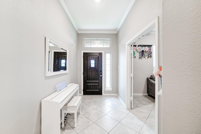 foyer featuring light tile patterned floors, baseboards, and crown molding