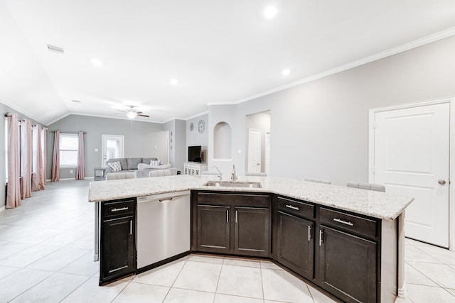 kitchen featuring light stone counters, light tile patterned floors, open floor plan, a sink, and dishwasher