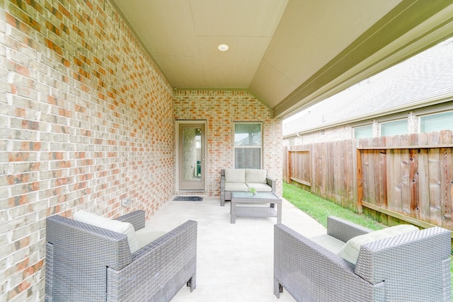 view of patio / terrace featuring fence and outdoor lounge area