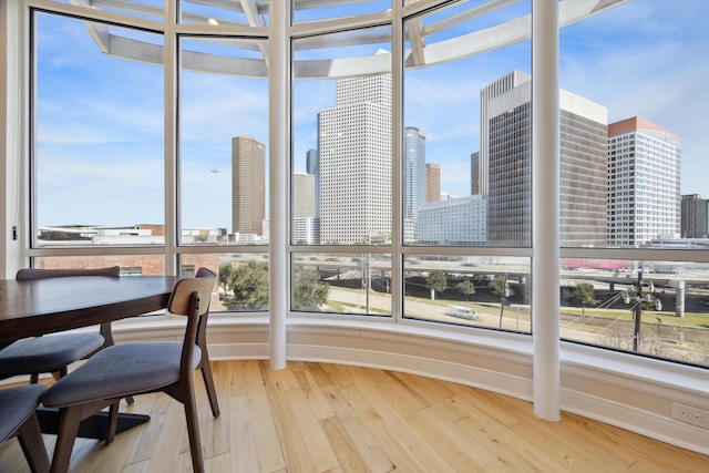 sunroom / solarium featuring a view of city