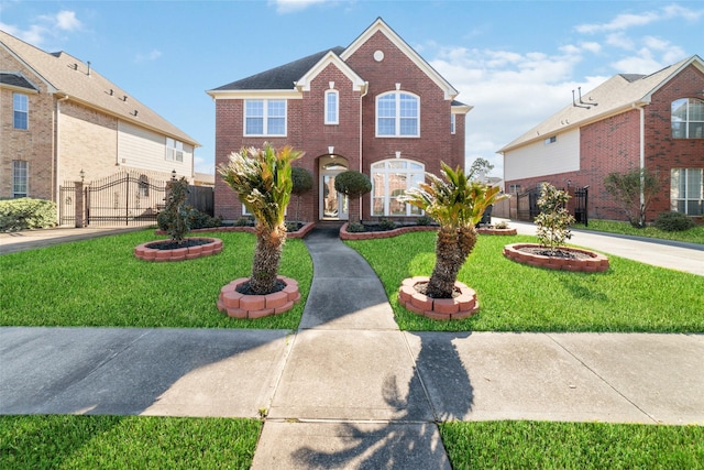 view of front of house with brick siding, a front lawn, and fence