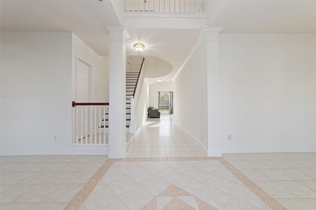 interior space with baseboards and stairway