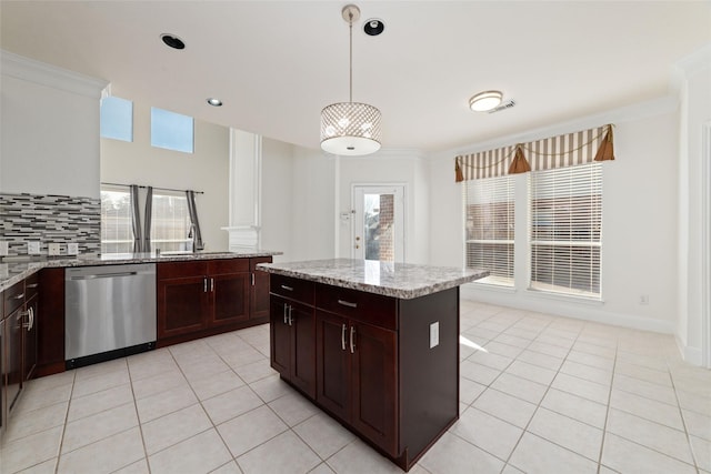 kitchen with a sink, light tile patterned floors, decorative backsplash, and stainless steel dishwasher