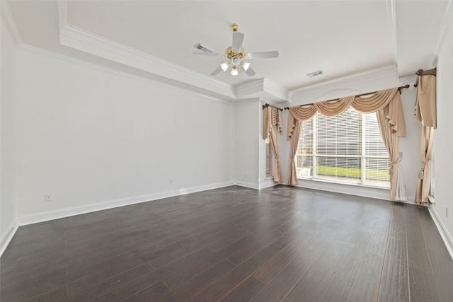 unfurnished room with crown molding, visible vents, dark wood-type flooring, ceiling fan, and baseboards