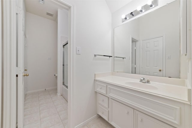 bathroom featuring tile patterned flooring, visible vents, vanity, and baseboards