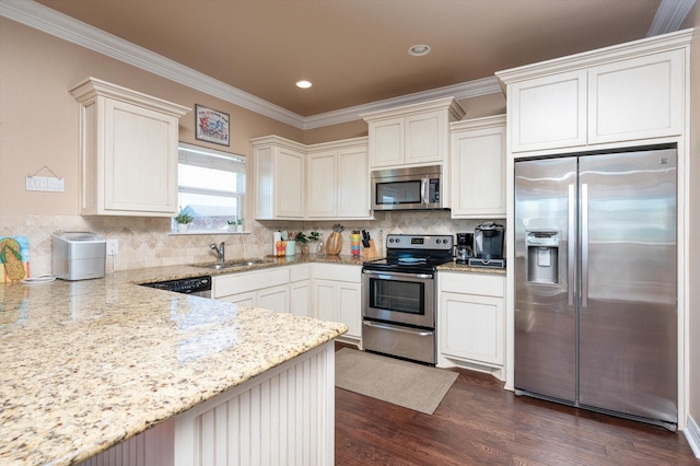 kitchen with light stone counters, dark wood-style flooring, decorative backsplash, appliances with stainless steel finishes, and a sink