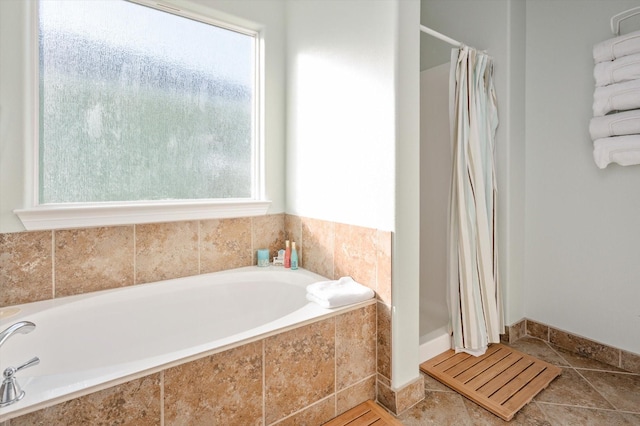 full bath featuring tile patterned flooring, a bath, and a shower with curtain