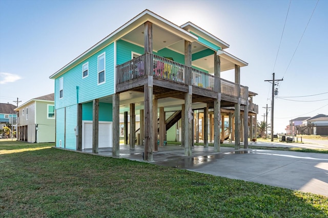 exterior space featuring a lawn, a carport, and concrete driveway