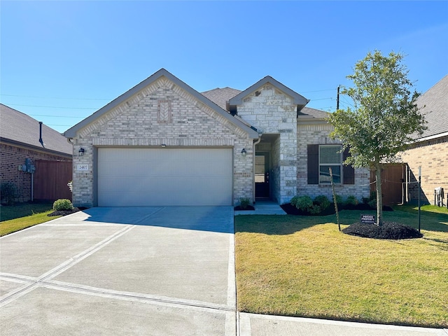 view of front of house with a garage, driveway, brick siding, and a front yard