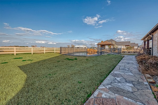 view of yard with fence and a gazebo