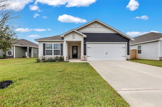 ranch-style home featuring a garage, concrete driveway, and a front lawn