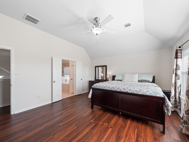 bedroom featuring vaulted ceiling, wood finished floors, visible vents, and baseboards