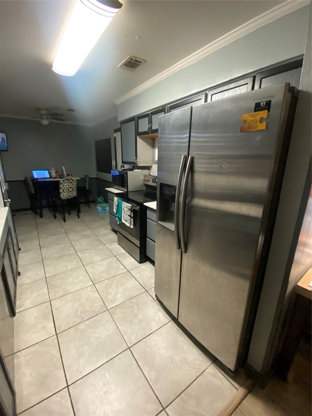 kitchen with stainless steel appliances, visible vents, crown molding, and light tile patterned flooring