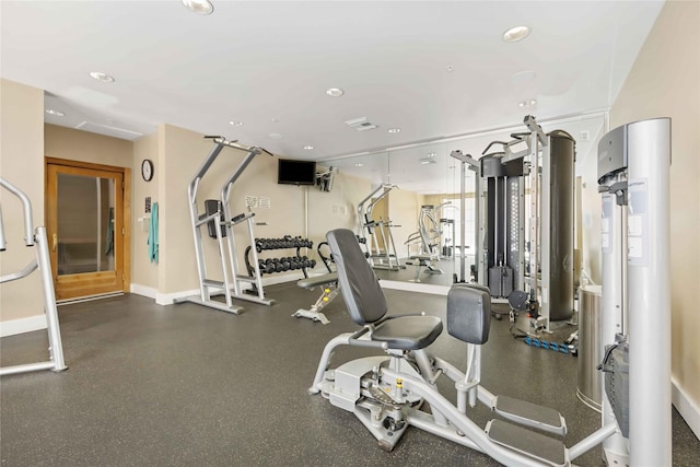 workout area featuring visible vents, baseboards, and recessed lighting