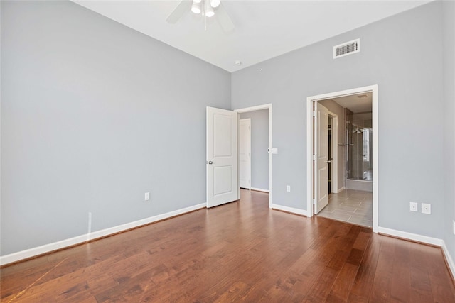 unfurnished bedroom with baseboards and wood finished floors