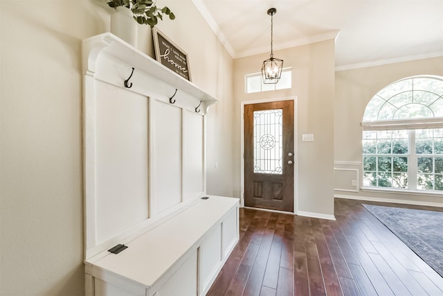 mudroom featuring ornamental molding, a chandelier, and dark wood finished floors