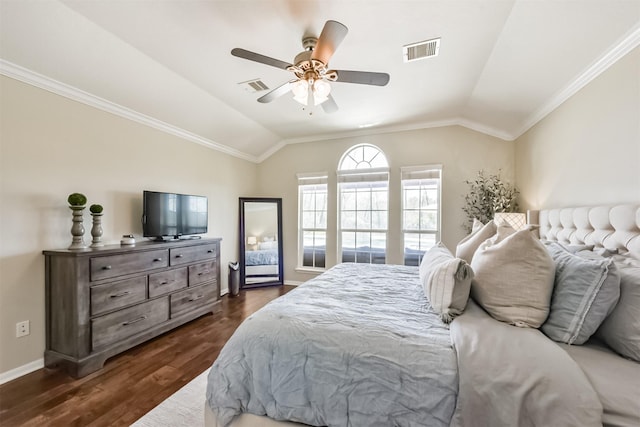 bedroom with visible vents, vaulted ceiling, and dark wood-type flooring