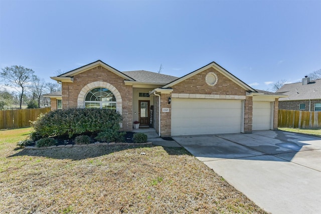 ranch-style house with concrete driveway, brick siding, an attached garage, and fence