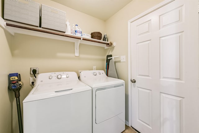 clothes washing area with laundry area and washer and dryer