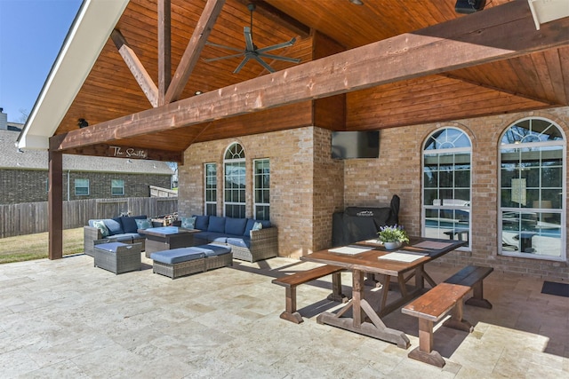 view of patio / terrace with a gazebo, fence, and an outdoor living space