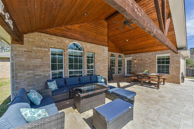 view of patio / terrace featuring ceiling fan and an outdoor living space