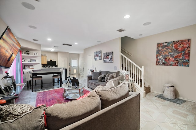 living area with stairway, baseboards, visible vents, and recessed lighting