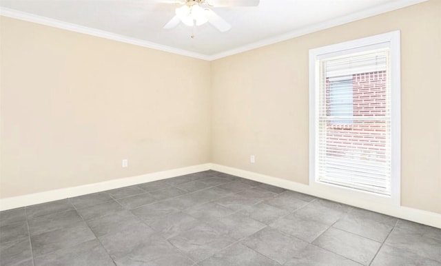 spare room featuring ceiling fan, ornamental molding, and baseboards