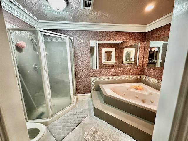 bathroom with a textured ceiling, visible vents, ornamental molding, a tub with jets, and a stall shower