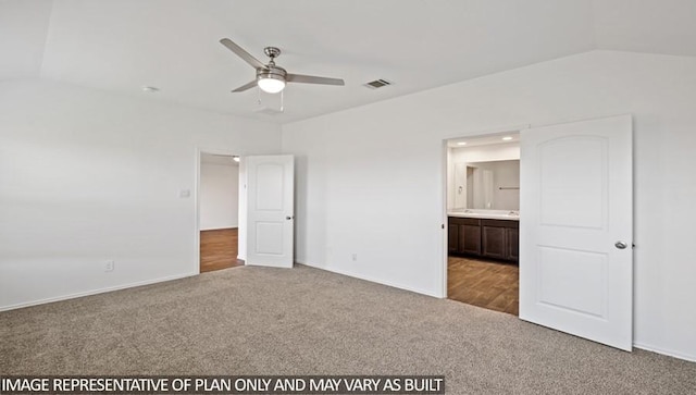 unfurnished bedroom featuring lofted ceiling, carpet, ensuite bath, and visible vents